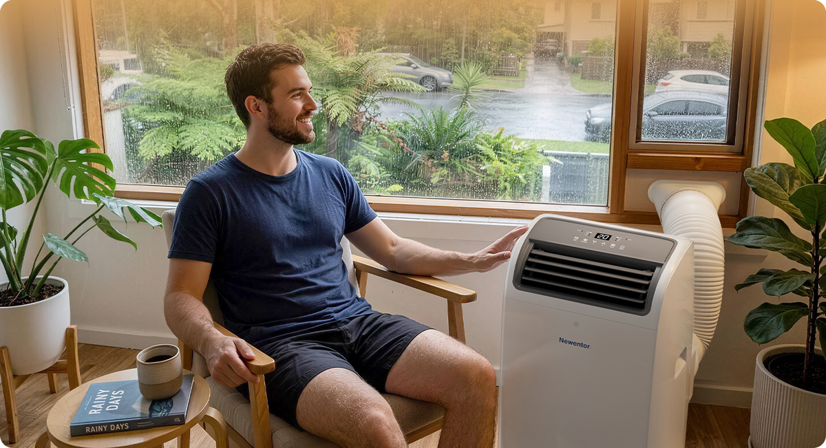 Newentor portable air conditioner dehumidifying a room on a rainy day