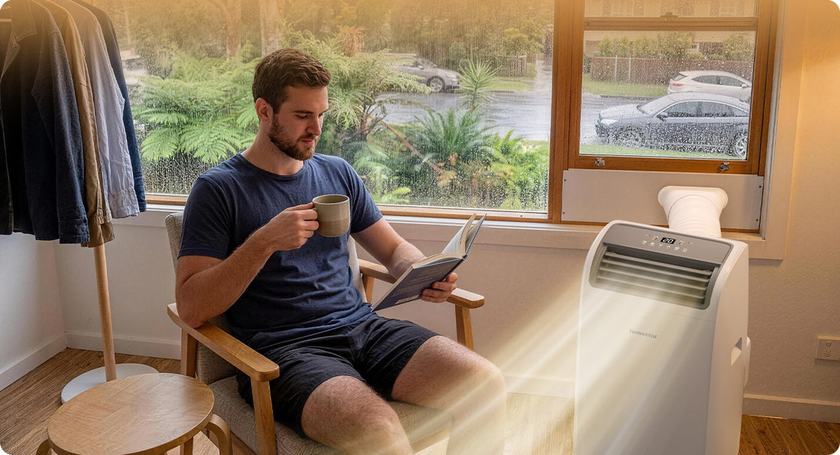 Newentor portable air conditioner dehumidifying a room on a rainy day