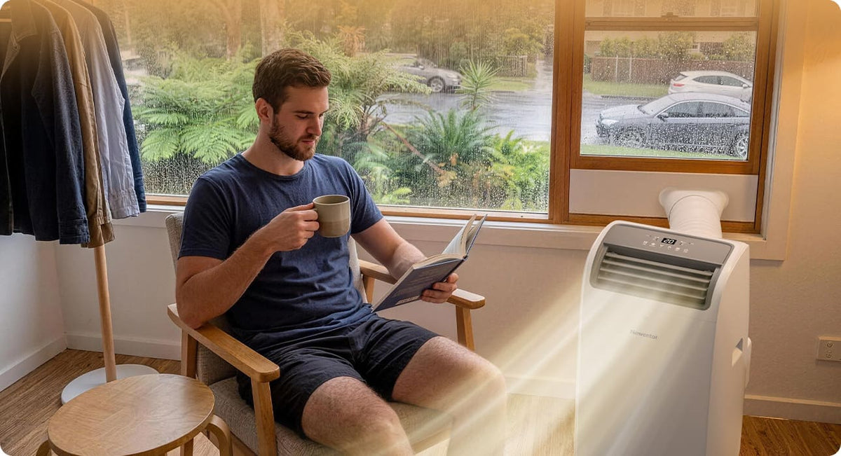 Newentor portable air conditioner dehumidifying a room on a rainy day